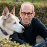 Photo of Arik Kershenbaum with his dog Darwin, a Canaan dog