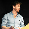 Photo of Duncan Astle talking at podium