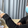 Photo of Micol Spitale shaking hands with Nao the humanoid robot