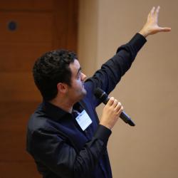Konstantinos Kyriakopoulos presenting at the poster slam Cambridge Language Sciences Annual Symposium 2019