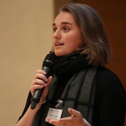 Victoria Poulton presenting at the poster slam Cambridge Language Sciences Annual Symposium 2019