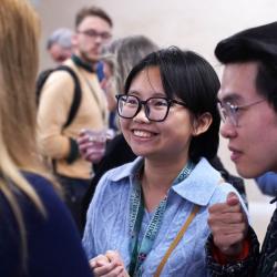 Annual Symposium 2023 - Attendees discussing 