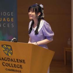 Photo of Aurora Gao chairing the poster slam