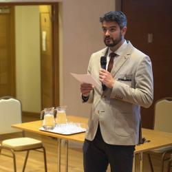 Dr Máté Aller during the poster slam Annual Symposium 2022