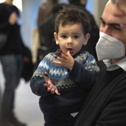 Photo of poster presenter with his young son