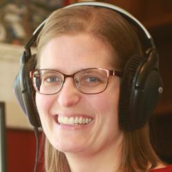Dr Kirsty McDougall in her office with computer screen in background