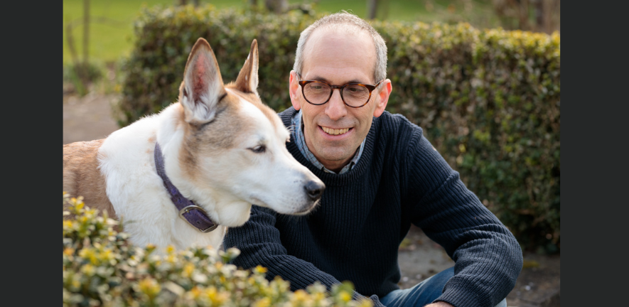 Photo of Arik Kershenbaum with his dog Darwin, a Canaan dog