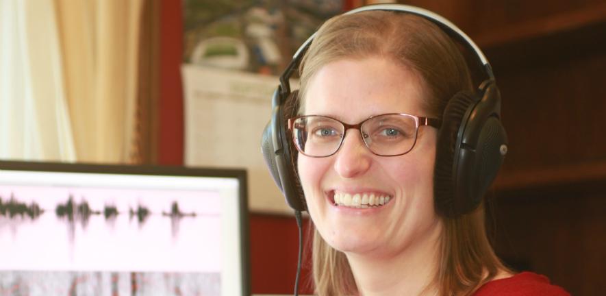 Dr Kirsty McDougall in her office with computer screen in background