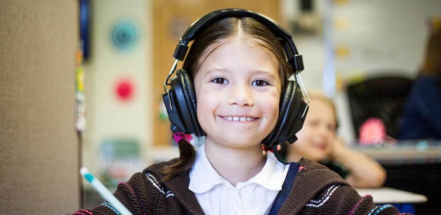 Photograph of a child in a school language lab