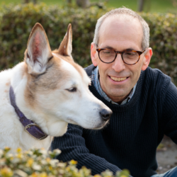 Photo of Arik Kershenbaum with his dog Darwin, a Canaan dog