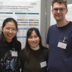 Poster presenters in front of their posters